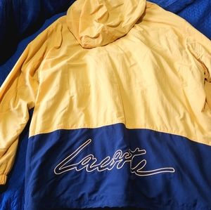 Lacoste wind breaker ligth hoodie size xxl but runs big ligth orange beautiful